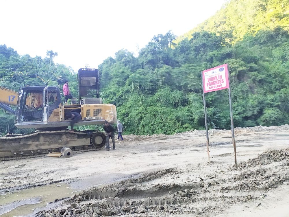 In this file photo a ‘work in progress’ sign is seen along the Chümoukedima to Kohima stretch of NH-29. (Morung File Photo)